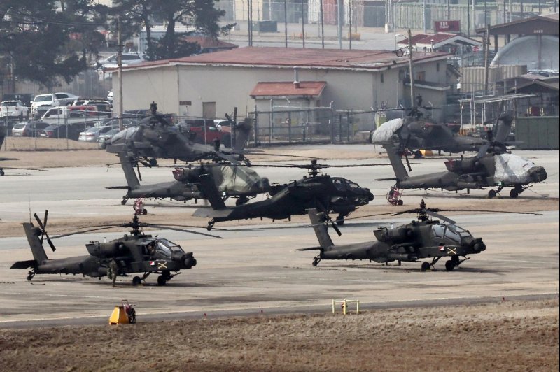 Apache choppers take off at Camp Humphreys in Pyeongtaek, South Korea, Monday as the Freedom Shield joint military exercise kicked off. North Korea on Tuesday warned of a "dear price" over the exercise. Photo by Yonhap