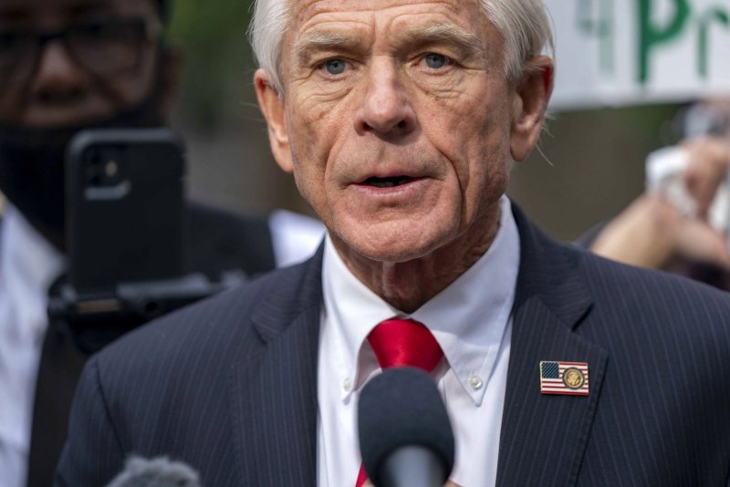 Peter Navarro, an adviser to former president Donald Trump, speaks to the press as he is surrounded by demonstrators after being found guilty of contempt of Congress in September. Navarro filed a last-ditch appeal to the Supreme Court on Friday to delay his prison sentence after a panel of judges denied his request Thursday. File Photo by Bonnie Cash/UPI