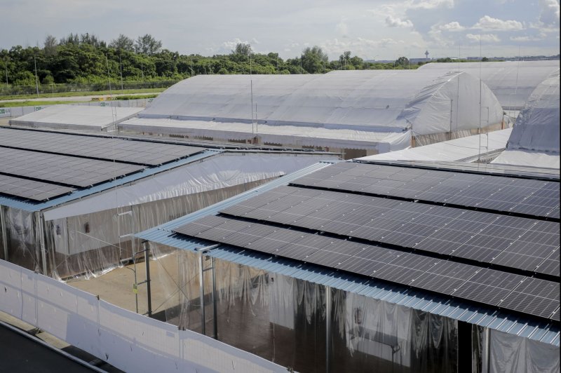 An image shows solar panels on the roof of living quarters used to house coronavirus patients at the Changi Exhibition Center Integrated Community Care and Recovery Facility in Singapore, on June 3. 2020. E-waste like solar panels is becoming a larger issue in landfills, a new report says. File Photo by Wallance Woon/EPA-EFE