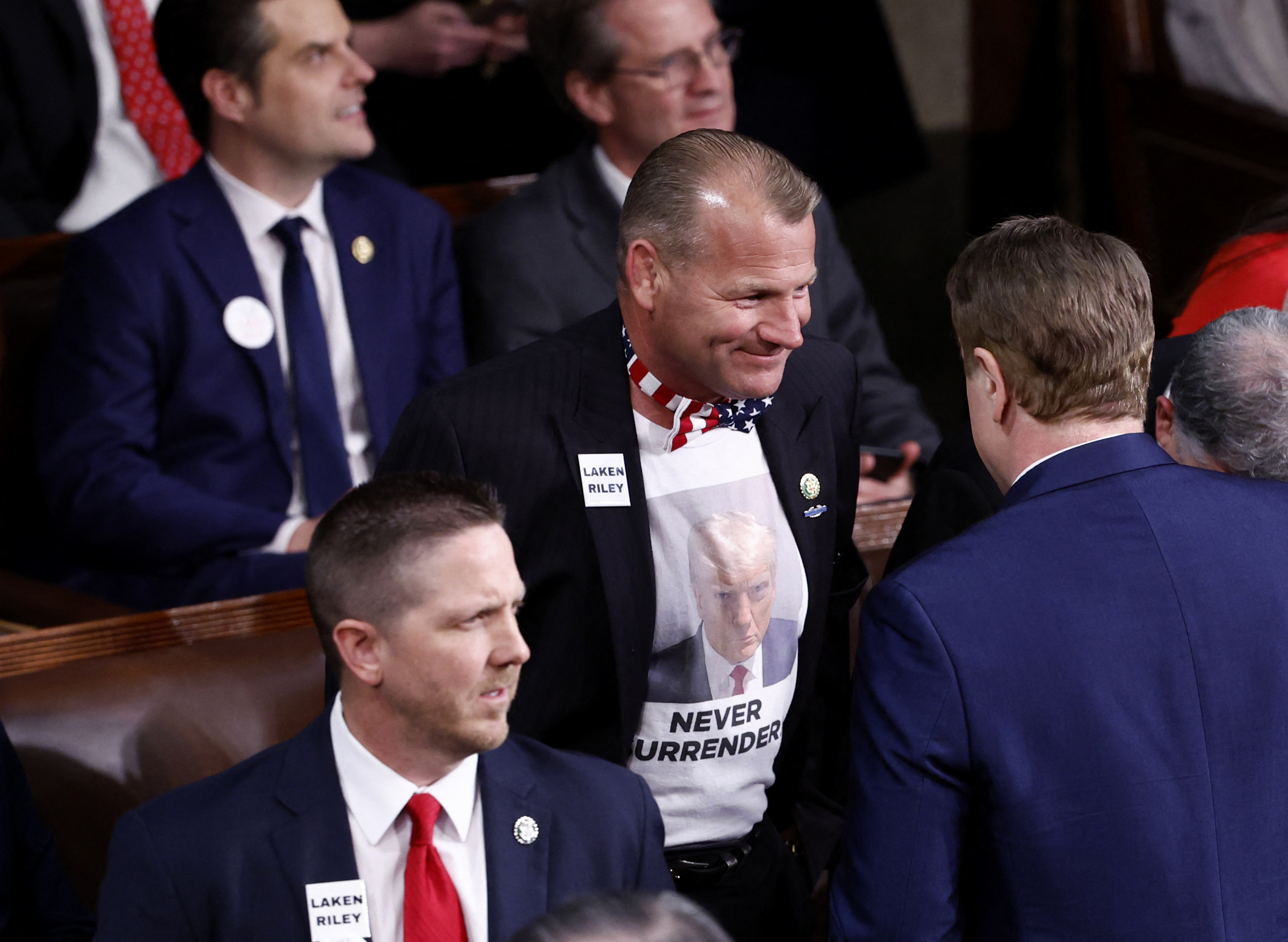 Representative Troy Nehls is wearing a shirt with Trump's face on it