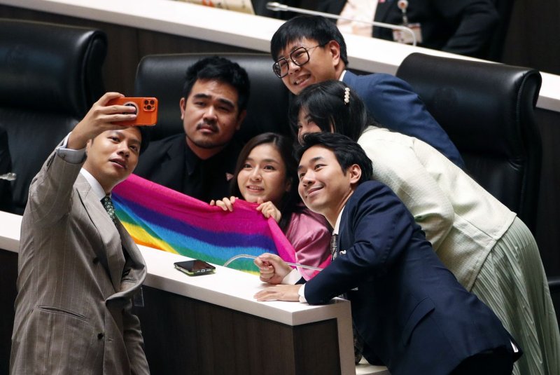 Lawmakers from Thailand's Move Forward Party celebrate the passing of a marriage equality bill Wednesday granting same-sex partnerships the same legal status as heterosexual unions in the lower house of Parliament in Bangkok. Photo by Rungroj Yongrit/EPA-EFE