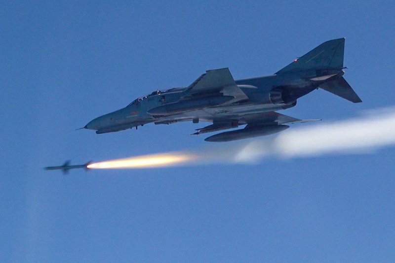 A South Korean F-4E fires an AIM-7M air-to-air missile at an aerial target during a joint live-fire drill with U.S. aircraft Friday. Photo courtesy of Republic of Korea Air Force