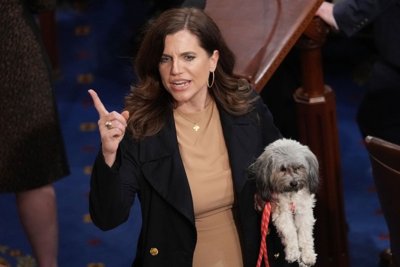 Rep. Nancy Mace, R-S.C., holds her dog after the 11th round of voting for U.S. Speaker of the House of Representatives in 2023. A three-judge panel determined South Carolina gerrymandered 30,000 Black voters out of her district in a "likely unconstitutional" move, but those same judges determined the old congressional map can stay in place because the Supreme Court has yet to issue a ruling in time for this year's elections. File Photo by Pat Benic/UPI