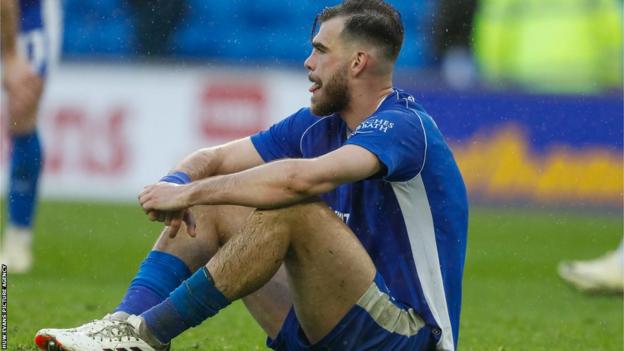 Centre-back Dimitrios Goutas shows his disappointment after goals from Adil Aouchiche and Jobe Bellingham gave Sunderland victory at Cardiff City on Friday