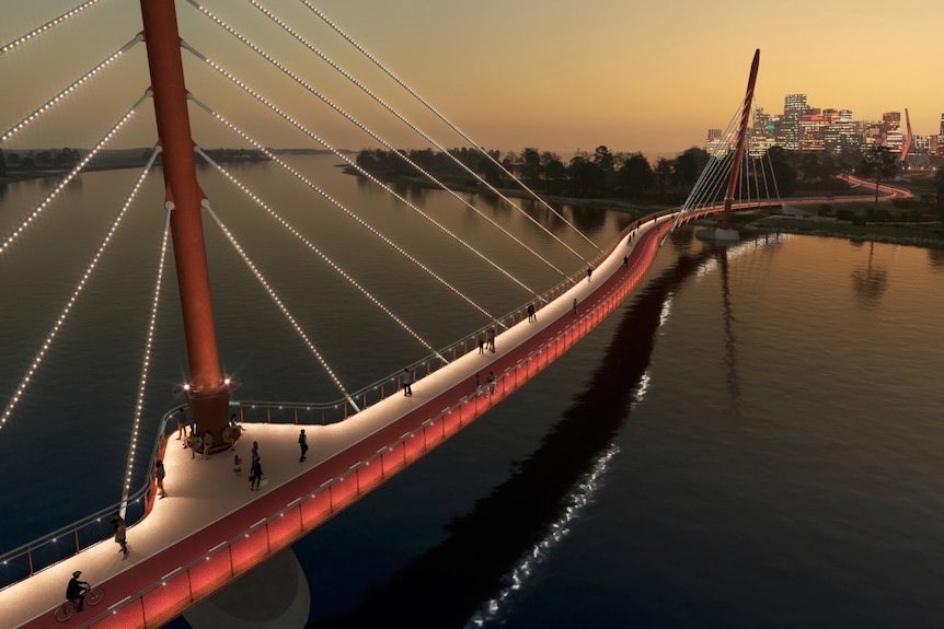 A red pedestrian bridge snakes over the swan river during sunset with city lights in the background, aerial shot.