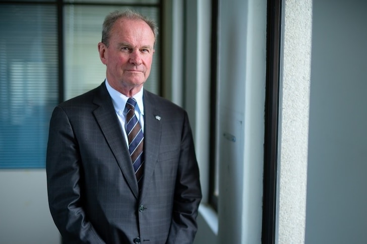  Martin Hamilton-Smith in a suit, inside an office. 