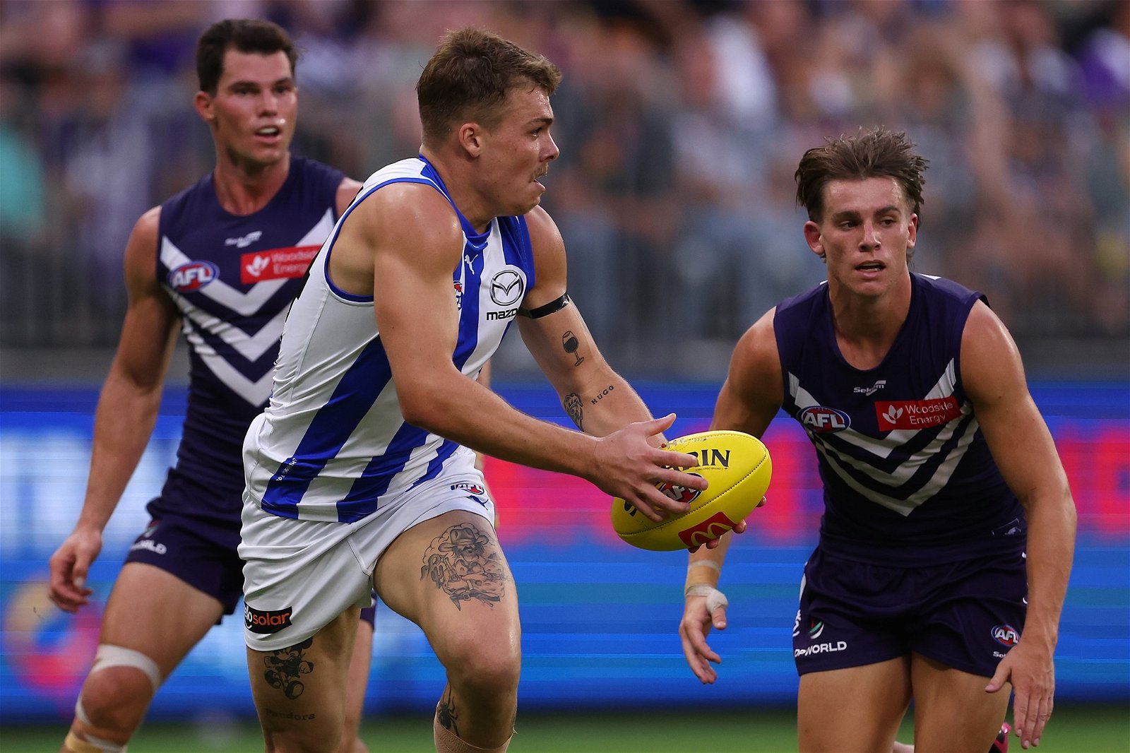 Cameron Zurhaar runs with the ball for North Melbourne against Fremantle.