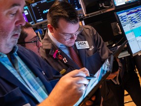 Traders work on the floor of the New York Stock Exchange.