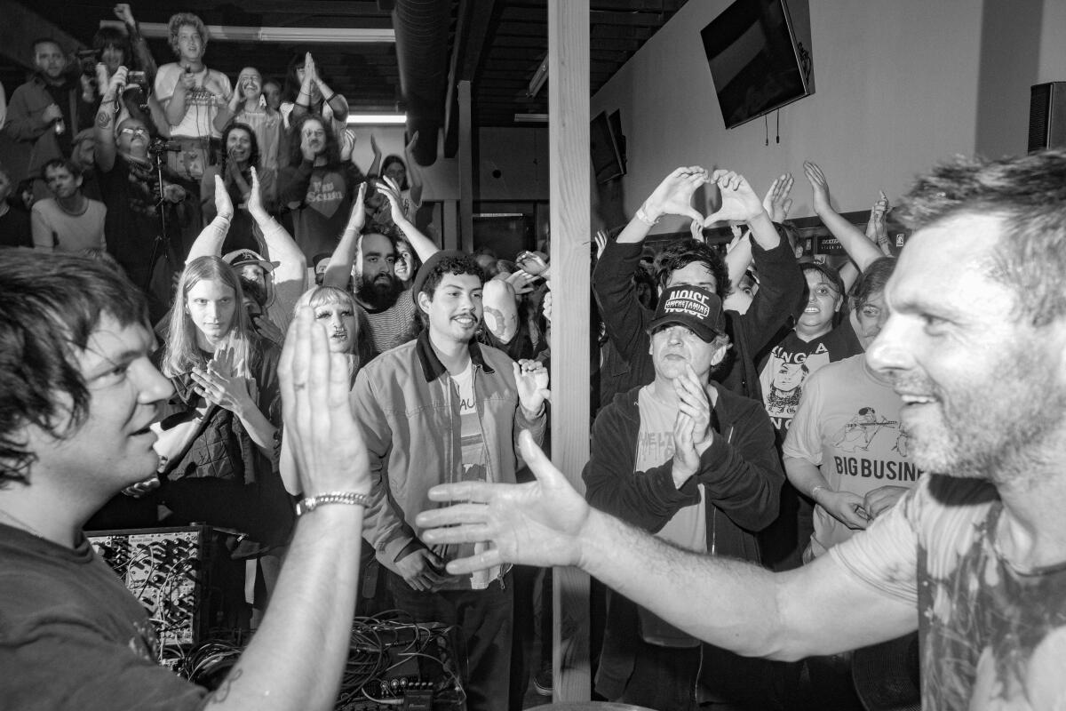 Brian Chippendale embraces Baby Aspirin DVD after their set at Laundry Wand.