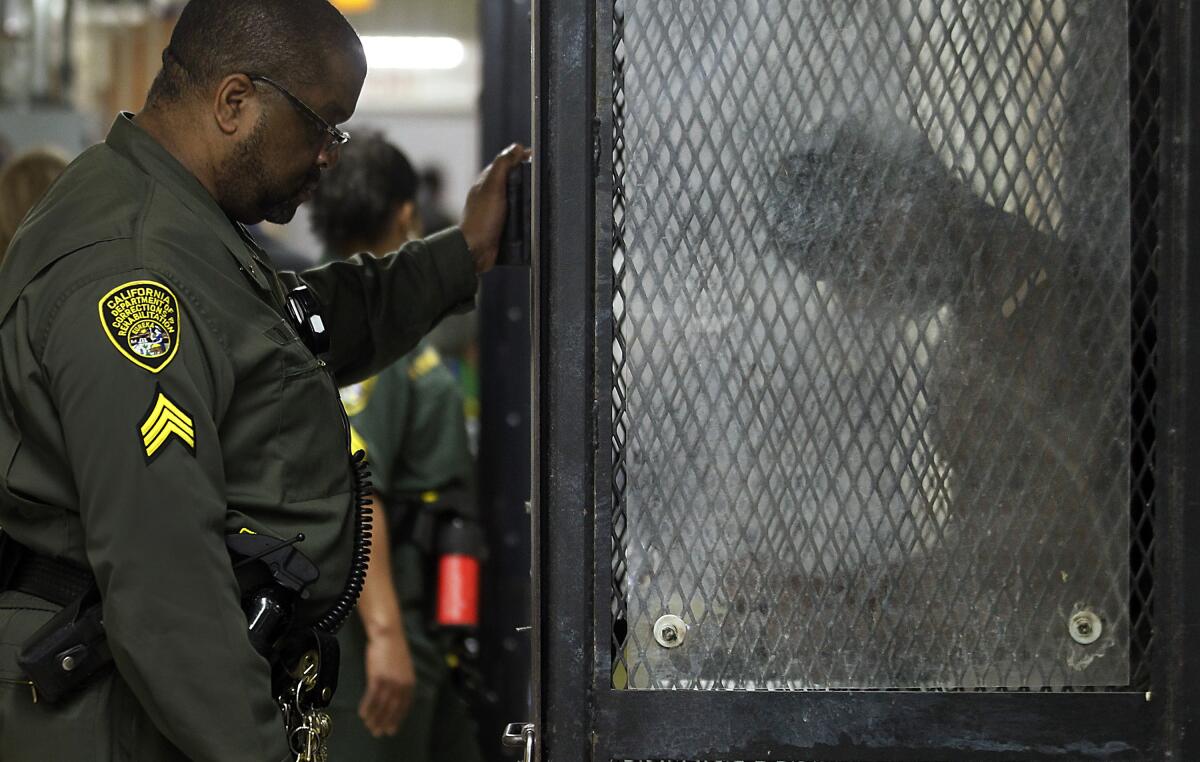 A prison guard with an inmate.