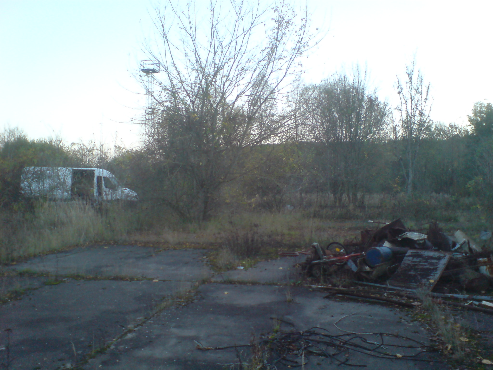 Our exclusive picture shows a white Mercedes Sprinter van parked at a creepy woodland site he later bought