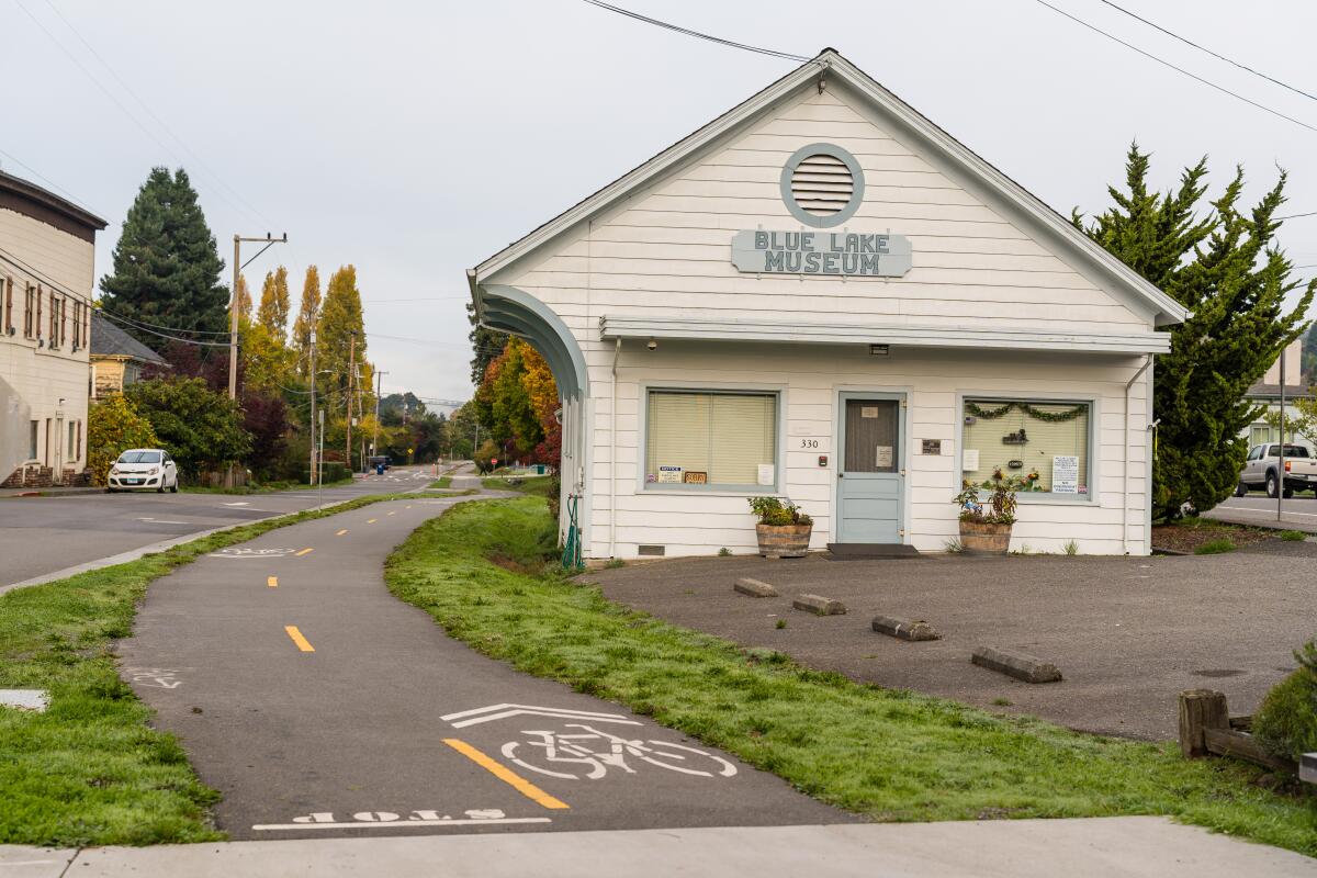 A home-like building with a sign reading "Blue Lake Museum"