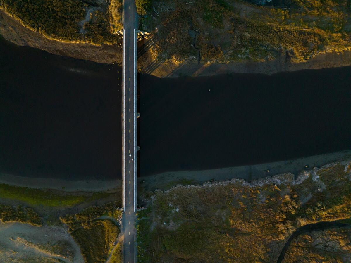 Overhead view of a bridge crossing a river