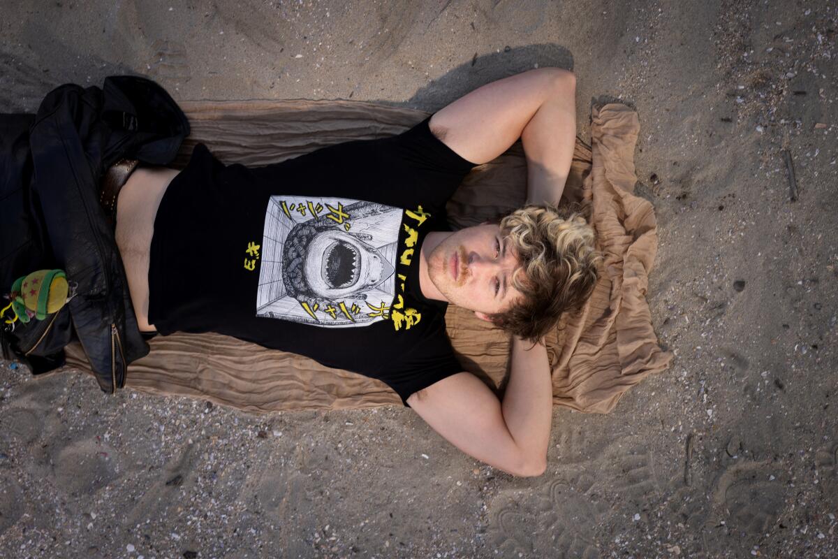 An aerial view of Jakob Nowell of Sublime, photographed on the sand in Long Beach.