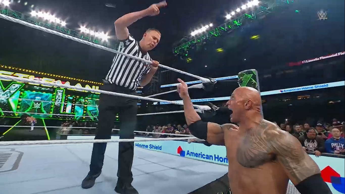 The Rock threatened to fire the ref if he counted anyone out and used expletive language