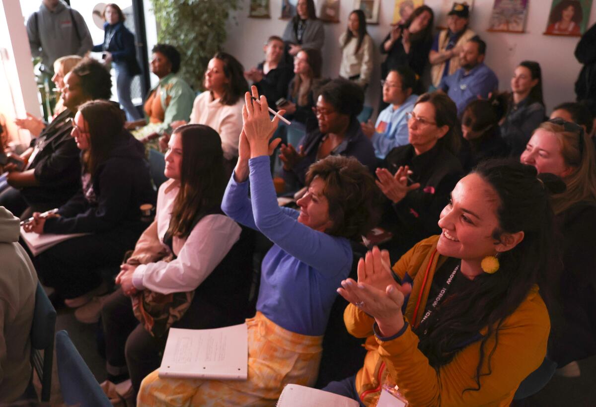 Comedy crowd watching a show and clapping