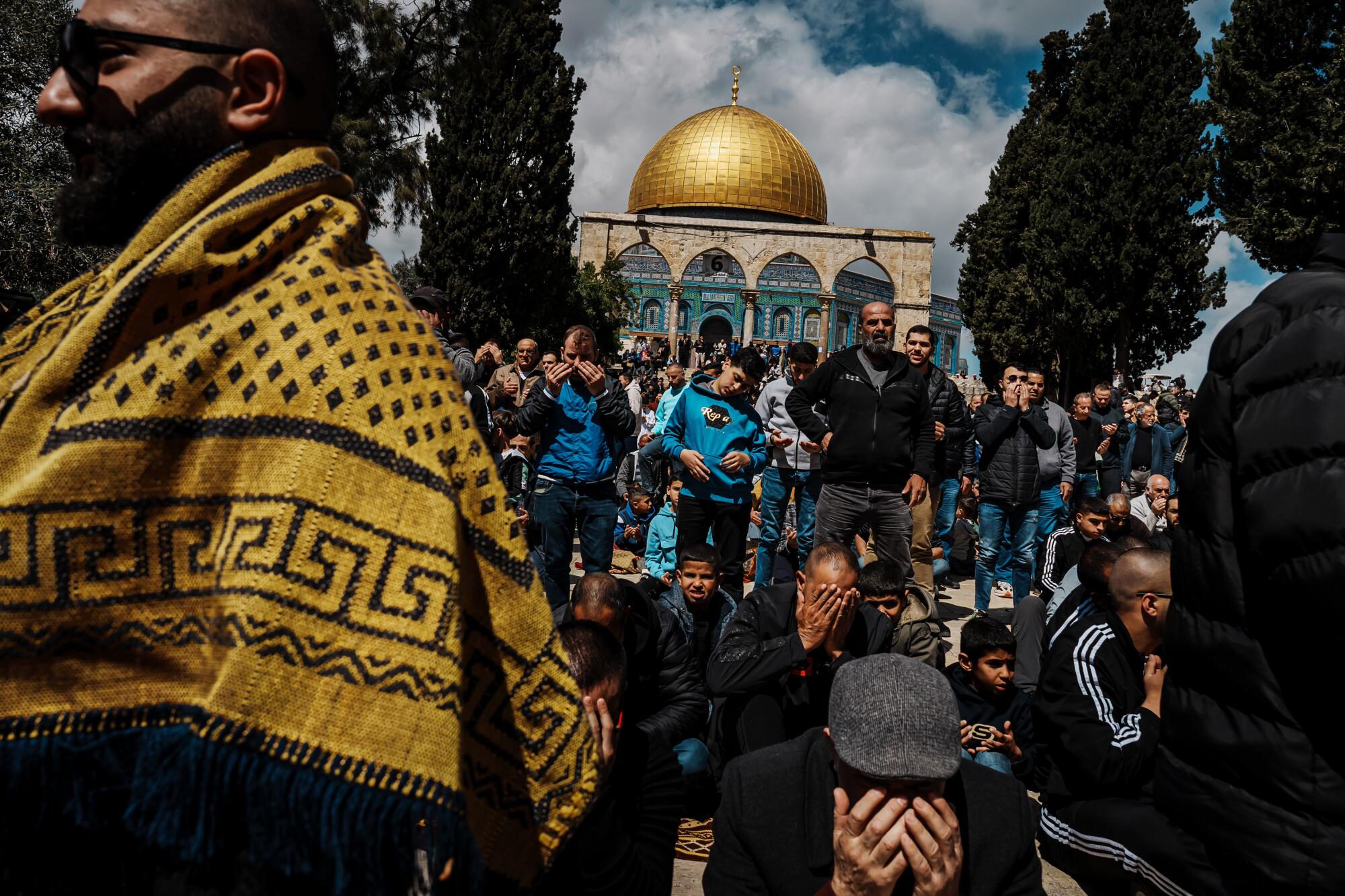 Worshippers listen to a sermon during noon prayers in the Al Aqsa Mosque.