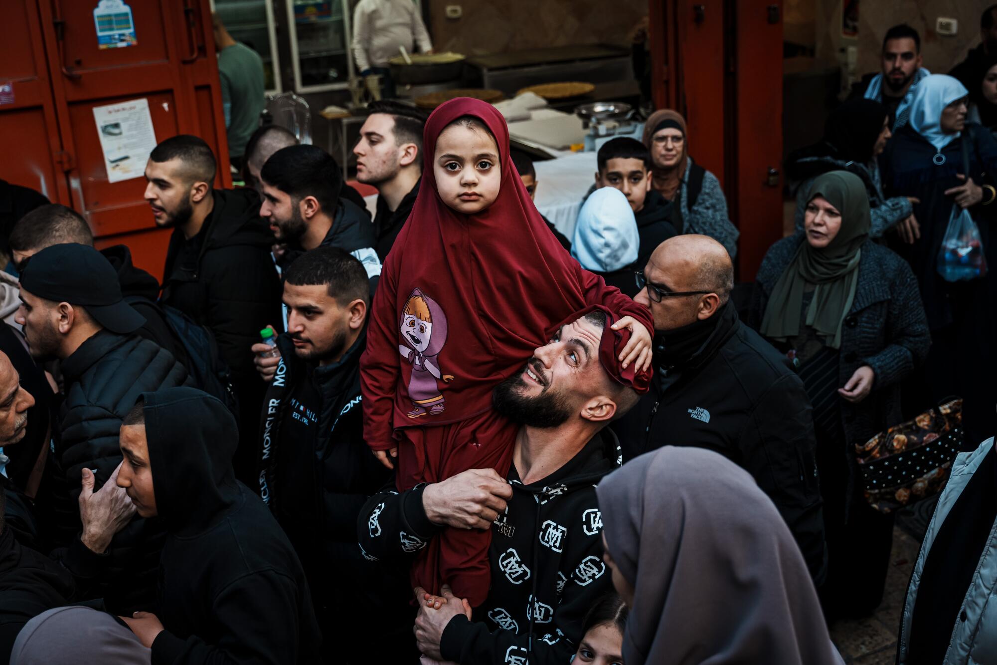 Devout Muslims make the pilgrimage into Al-Aqsa carrying their Iftar meals, and sometimes their children.