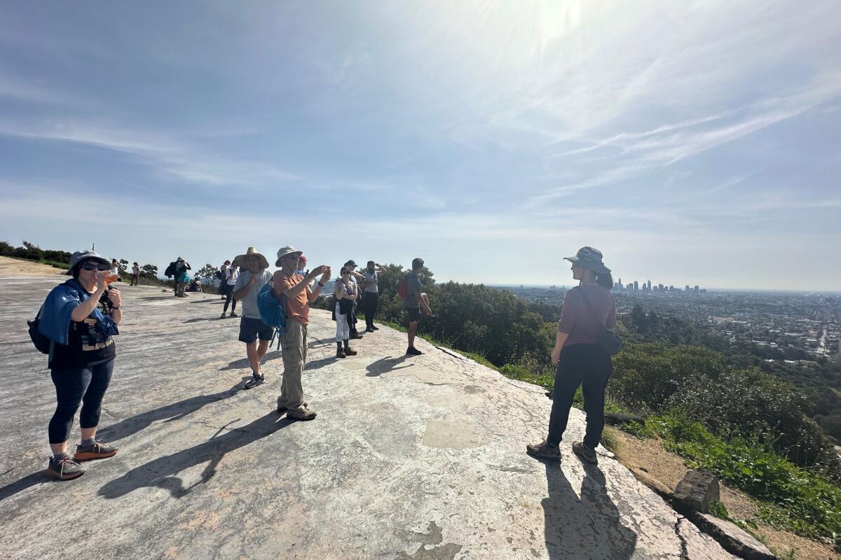 A group of hikers take a break to admire the view.