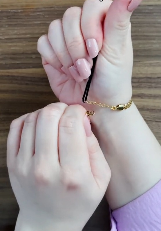 The final fastening step included holding the bobby pin in your hand and wrapping the bracelet around your wrist