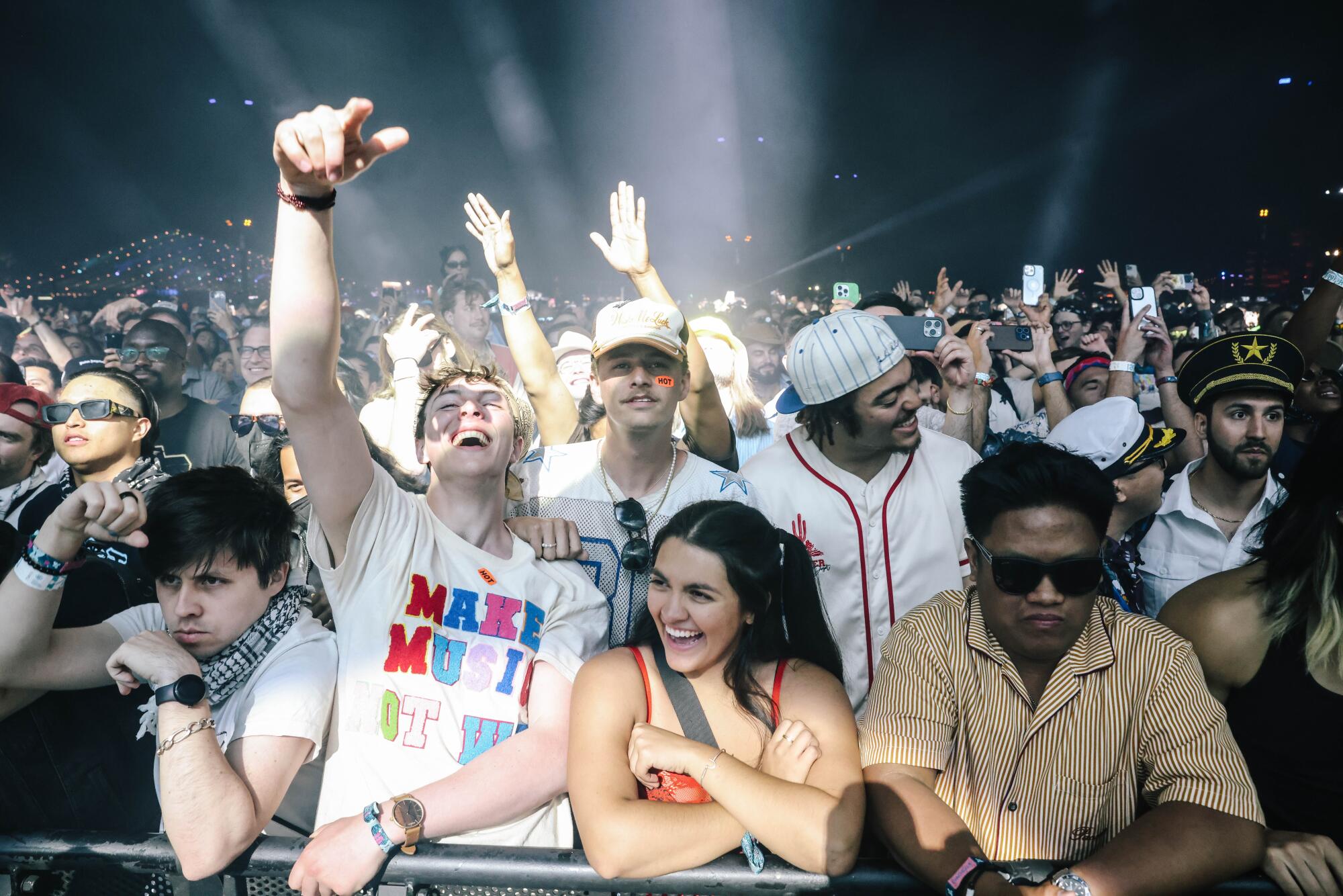 Fans listen as Justice plays on stage at Coachella.