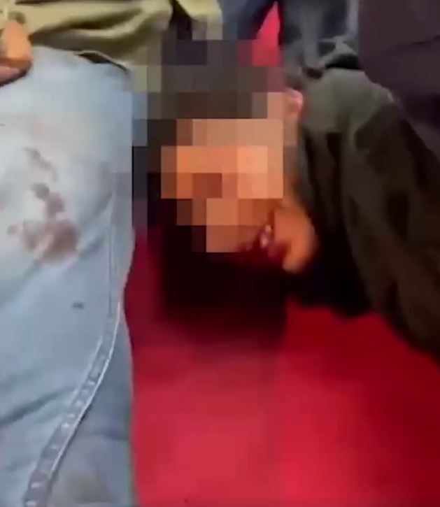 Footage showed the attacker smiling as he was pinned to the floor