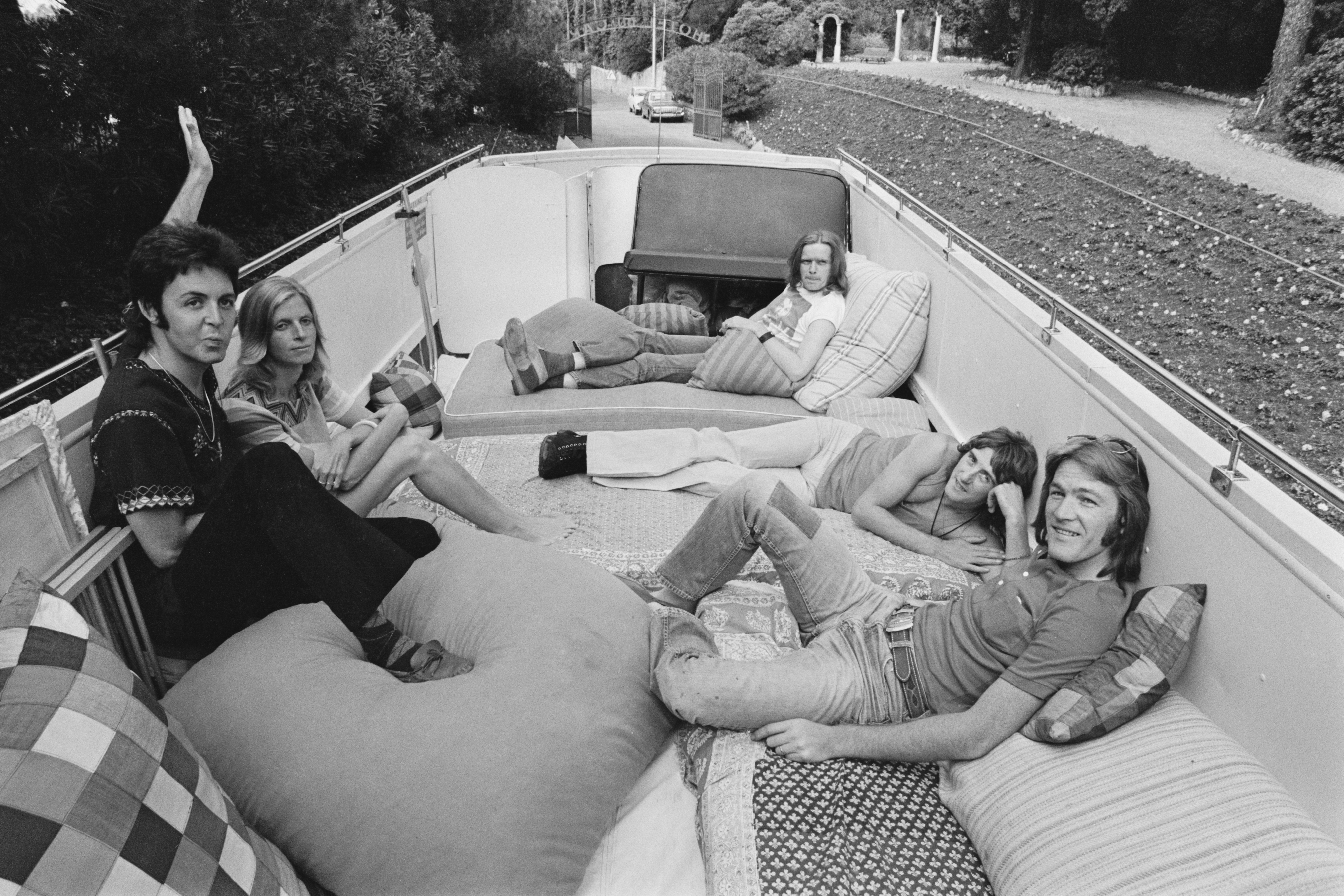 The band members relax on the open top