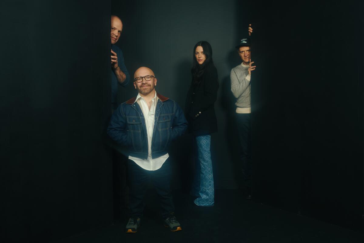 A group of filmmakers pose for the camera.