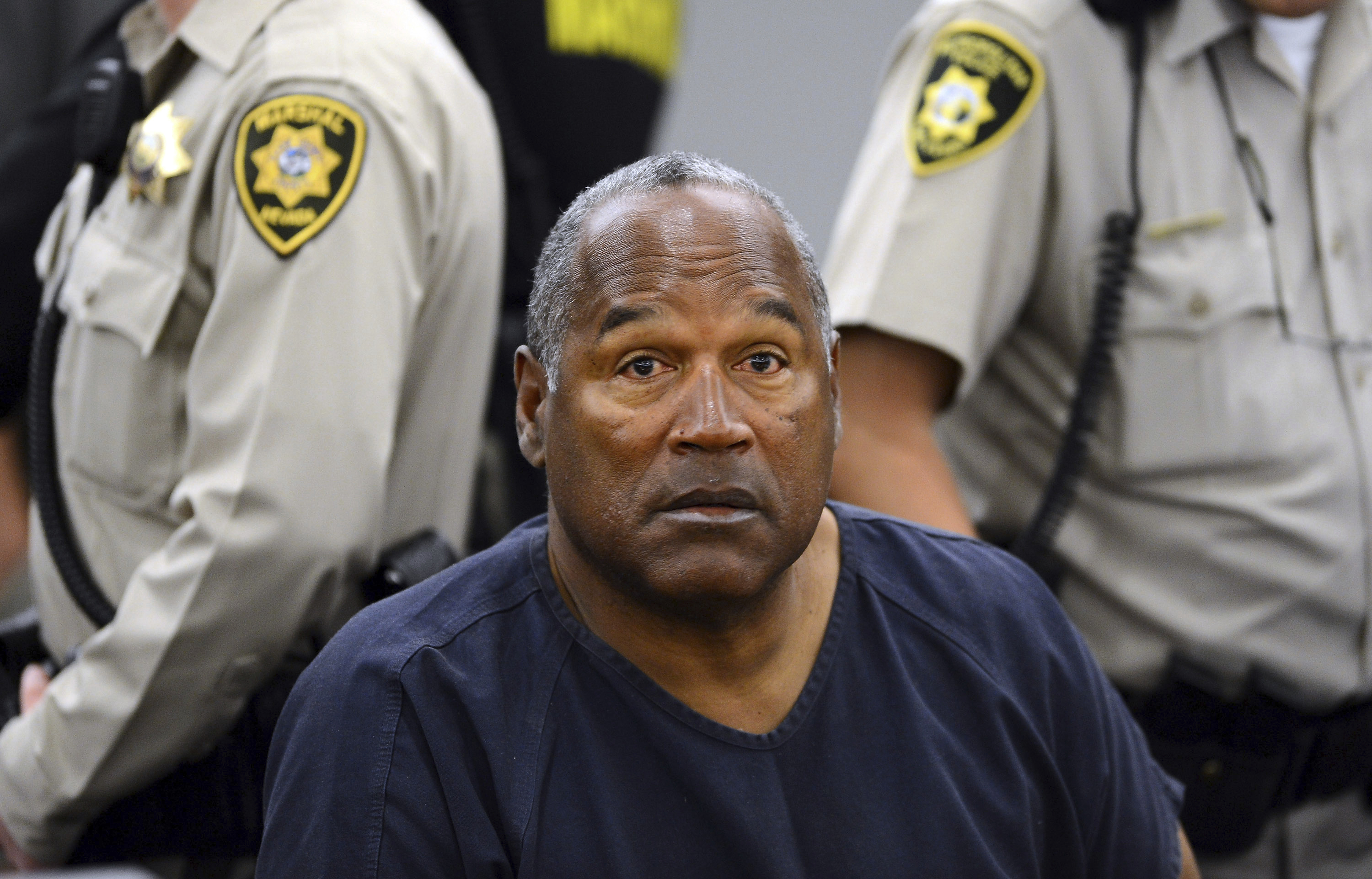 OJ Simpson sits during a break on the second day of an evidentiary hearing in Clark County District Court, May 14, 2013, in Las Vegas