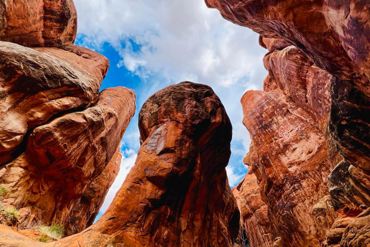 Towering red rocks at Fiery Furnace in Arches National Park. 