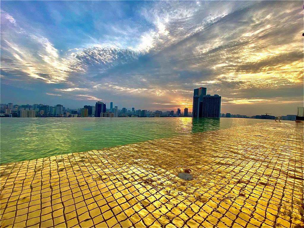 One of the highlights is the rooftop infinity pool with gold tiles