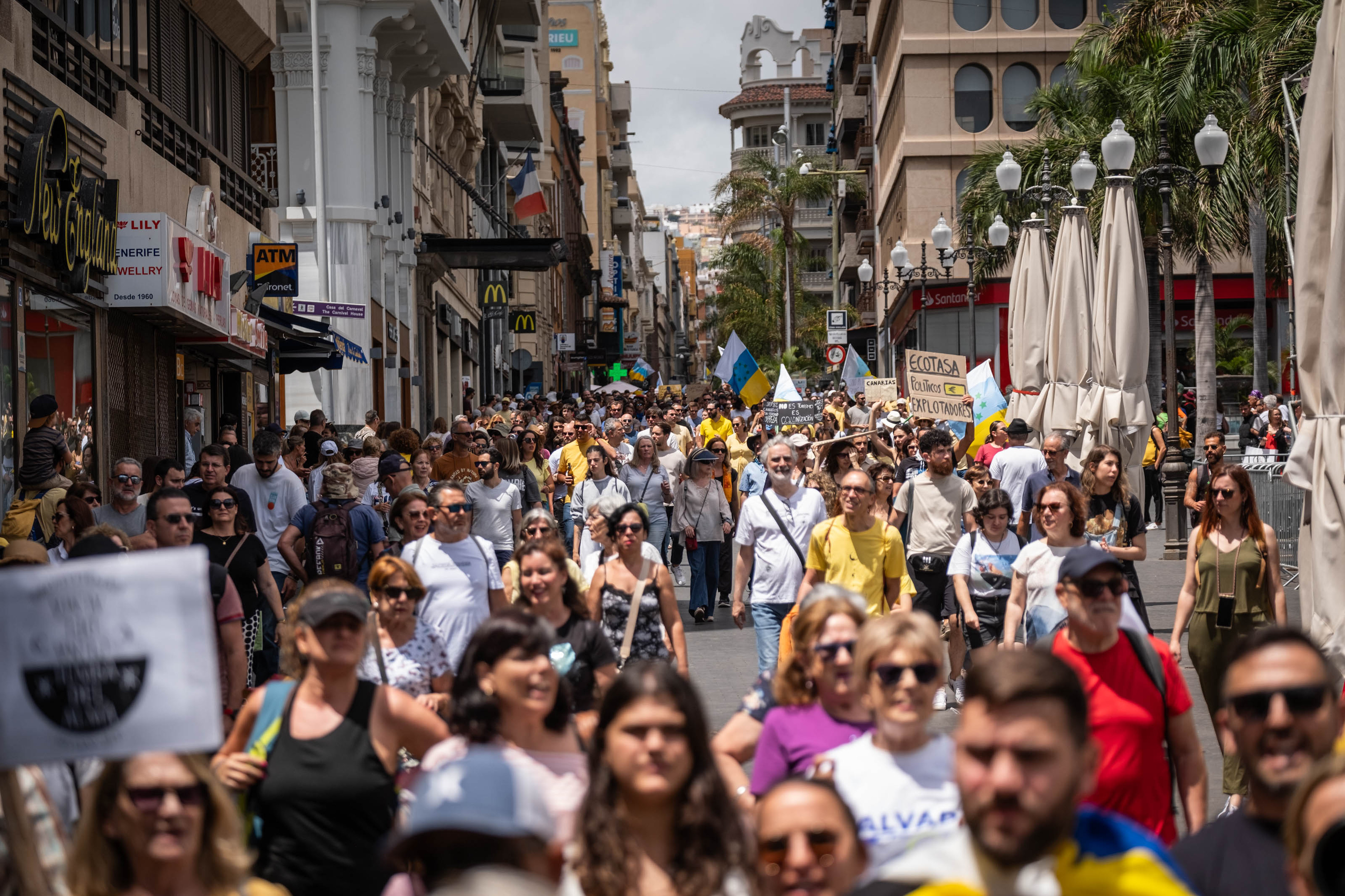 They carried banners complaining about mass tourism in the holiday hotspot