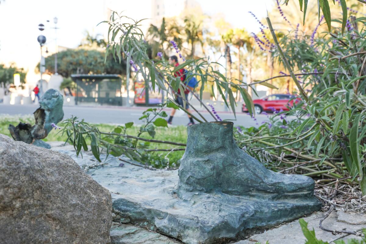 Just the feet remain from a bronze statue of a newsboy stolen from MacArthur Park.