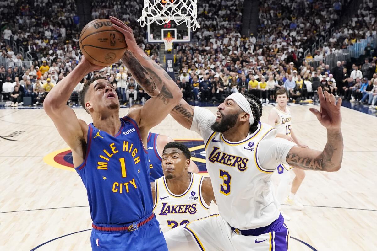 Nuggets forward Michael Porter Jr. goes up to shoot against Lakers forward Anthony Davis during their playoff series