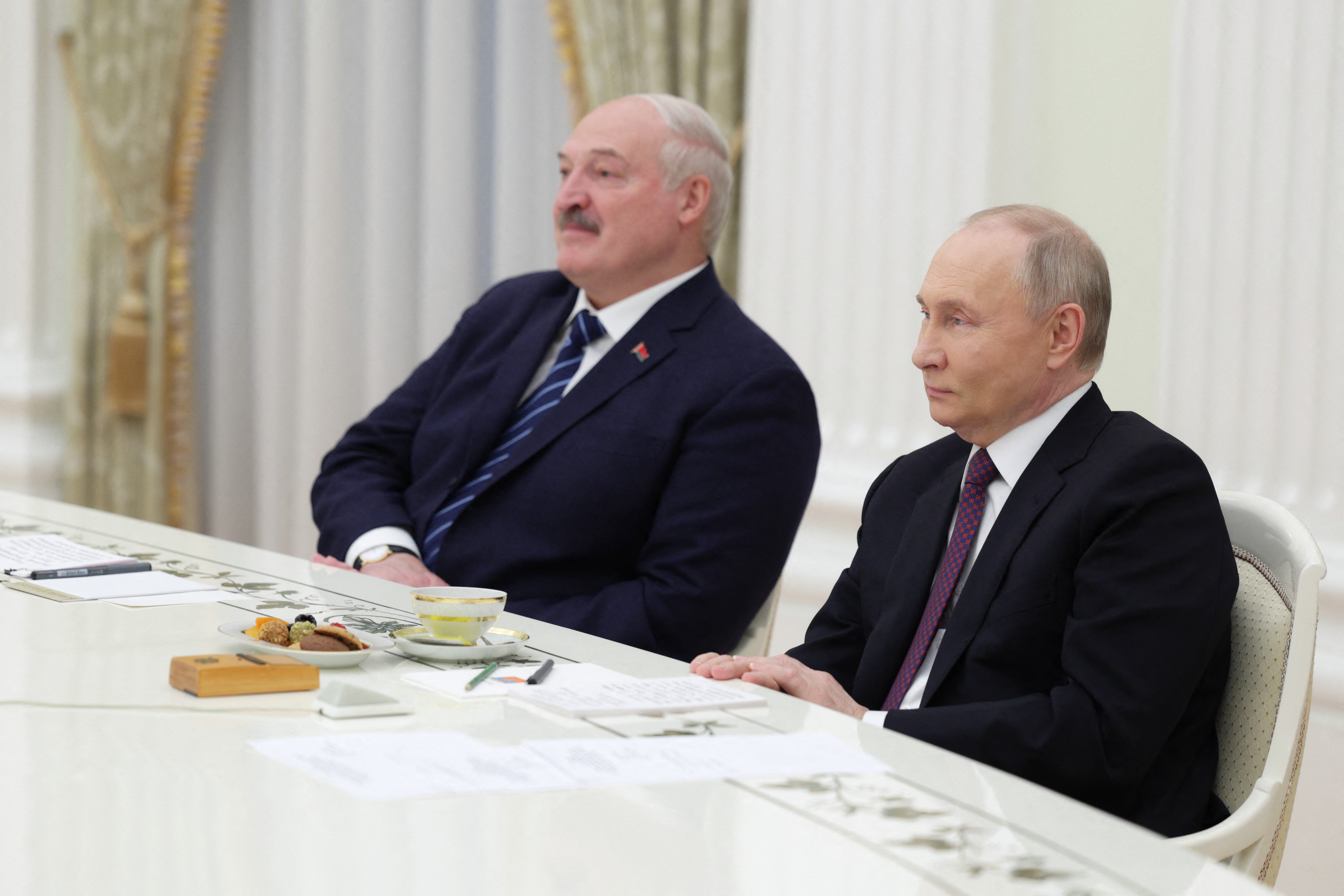 Putin with his puppet pal Belarusian president Alexander Lukashenko who stores his nuclear warheads for him