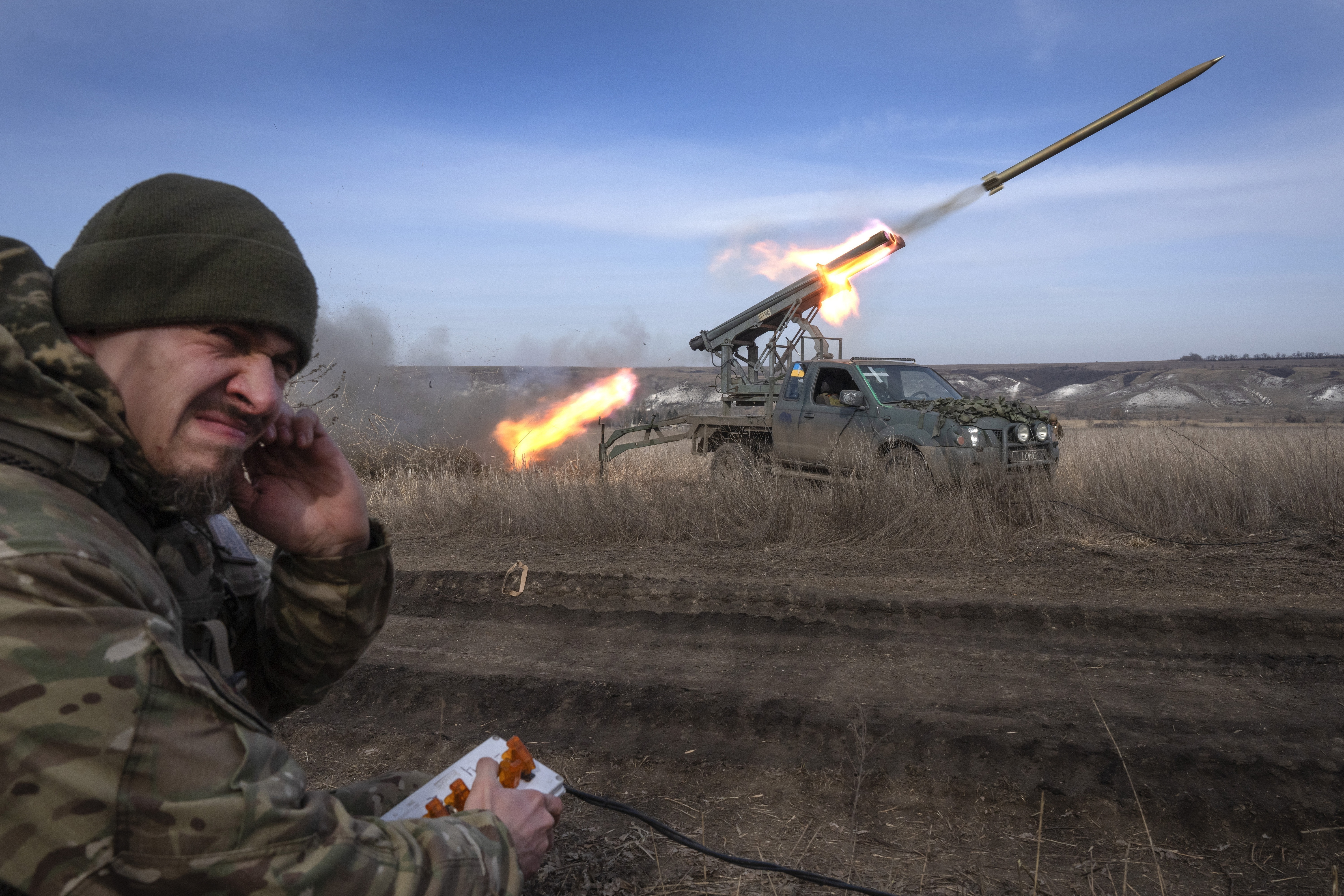 A Ukrainian troop firing rockets from a pick-up truck