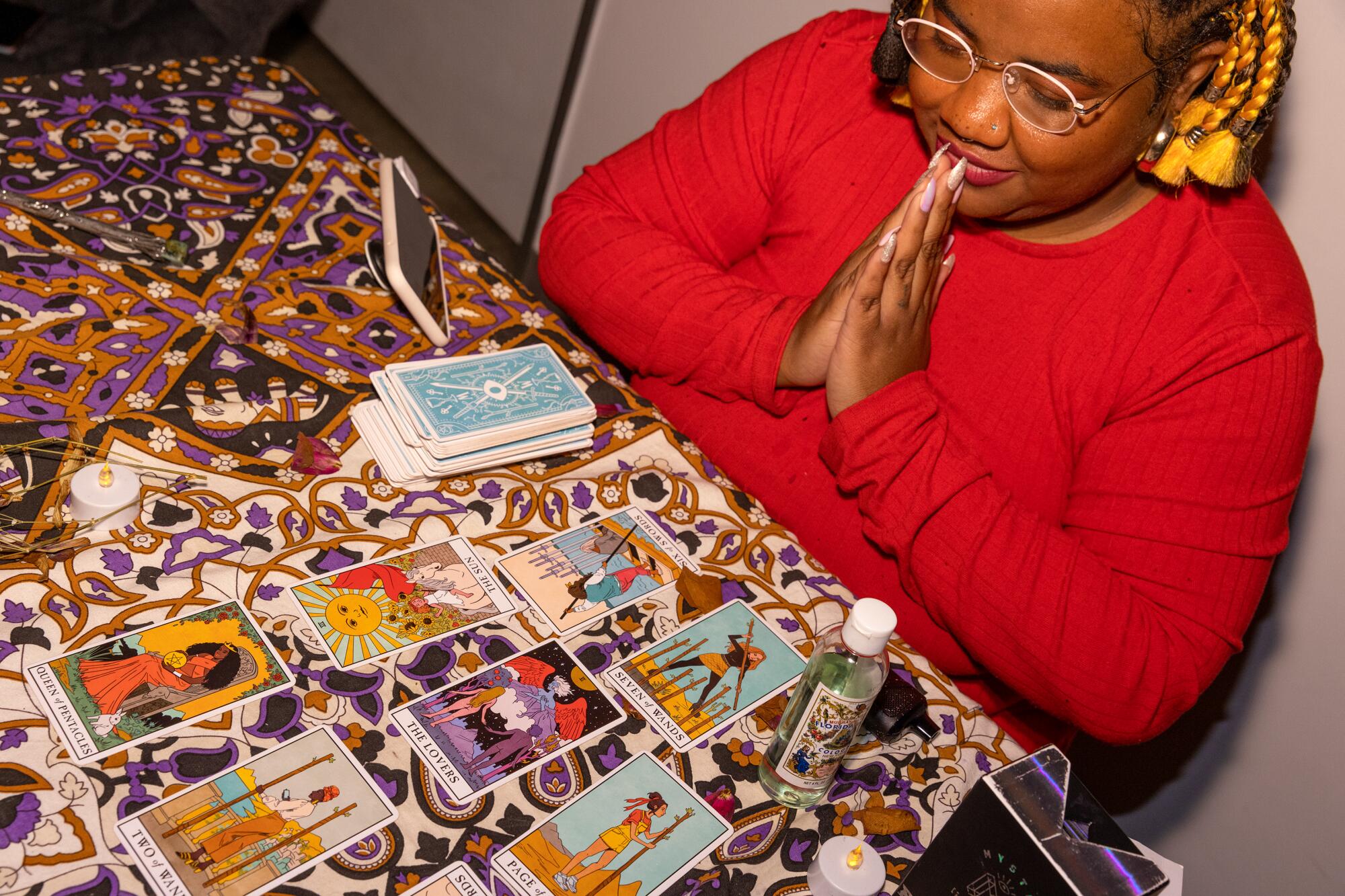 A person gives a tarot-card reading.