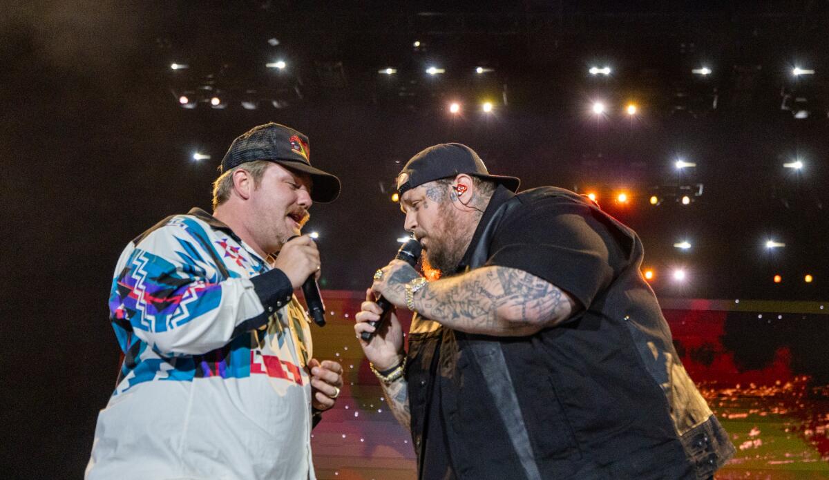 Two singers perform on stage at Stagecoach.