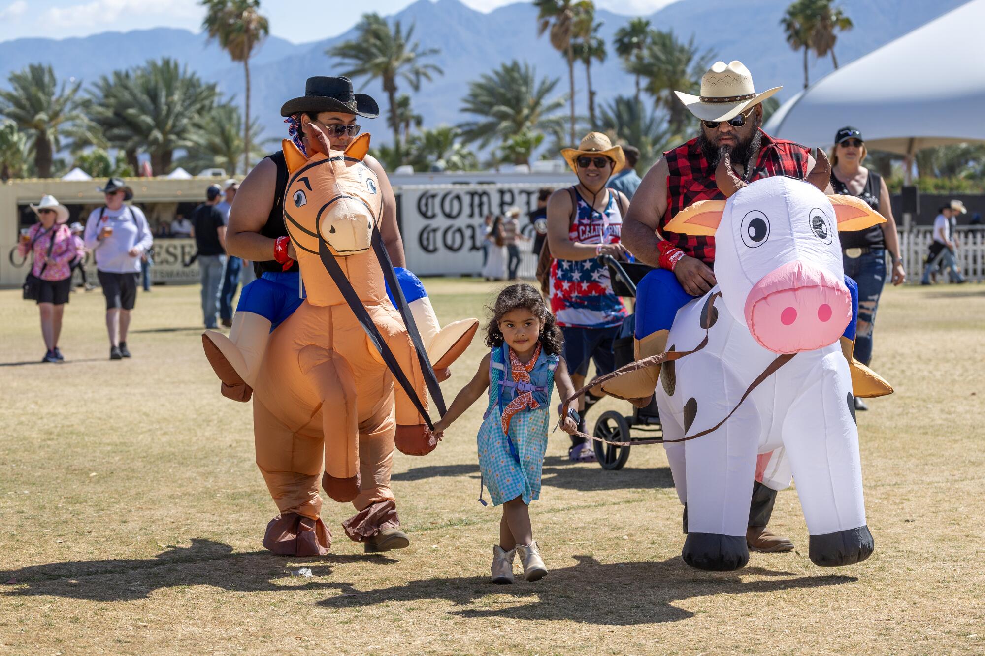 Compton Cattle Drivers David Caballero and Jasmine Caballero are led by their niece Daniela Marin at Stagecoach.