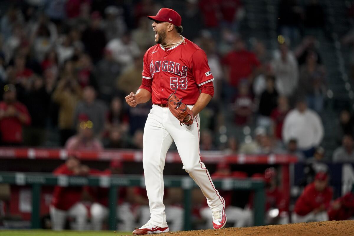 Angels relief pitcher Carlos Estévez celebrates after striking out Philadelphia's Brandon Marsh.