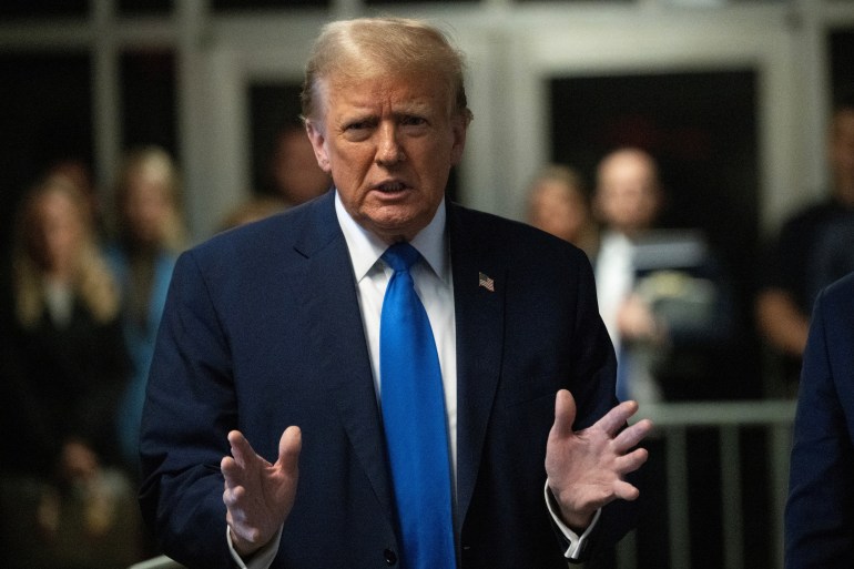 Donald Trump speaks to reporters outside a New York City courthouse