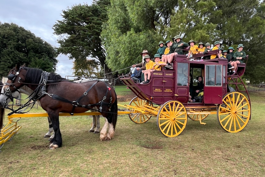 Children on a stagecoach with horses