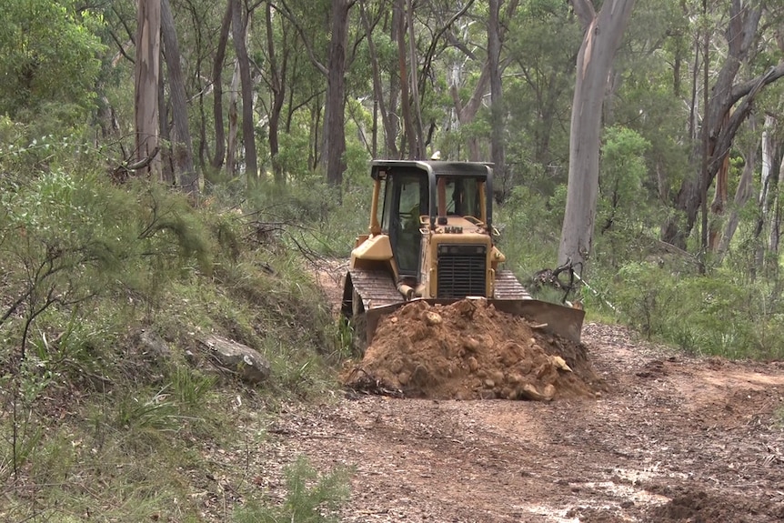 A bulldozer pushing dirt