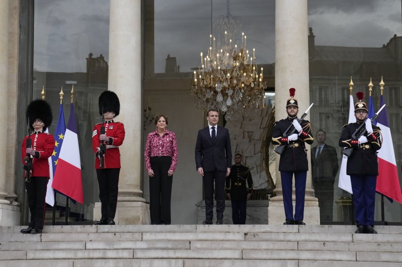 British Army Coldstream Guards flank French President Emmanuel Macron (C-R) and British ambassador to France Menna Rawlings (C-L) at the Elysee Palace in Paris for a joint guard with the Gendarmerie Garde Republicaine, the first time any foreign power has protected the presidential residence, in a special ceremony to celebrate 120 years of 'Entente Cordiale'. Photo by Thibault Camus/EPA-EFE