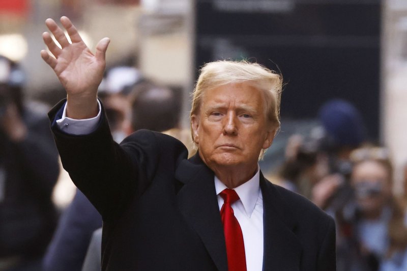 Former President Donald Trump waves after a press conference in New York on March 25. On Monday, he updated his stance on abortion rights, saying the issue should be decided by states. Photo by John Angelillo/UPI