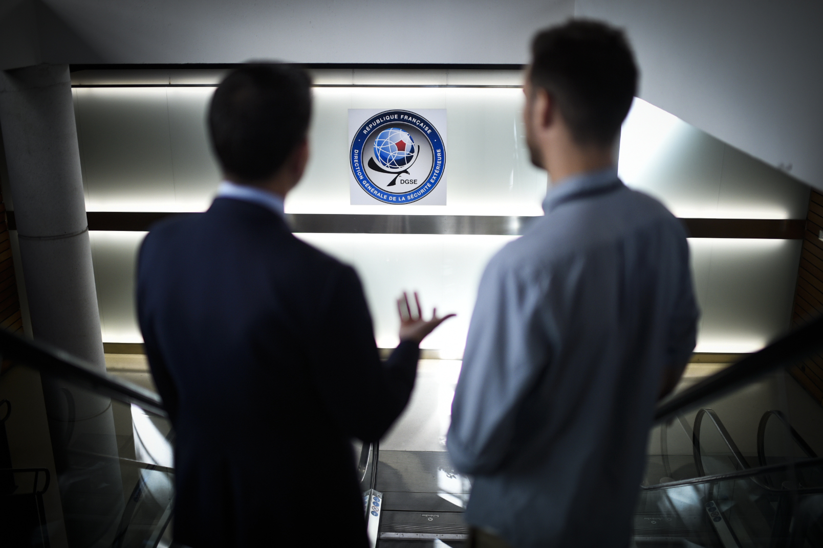 Two men pose at the headquarters of the General Directorate for External Security. Stock pic