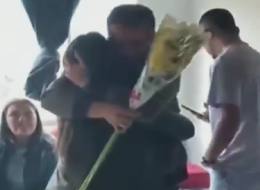 Her brother Fidencio got her flowers as they reunited with a long embrace