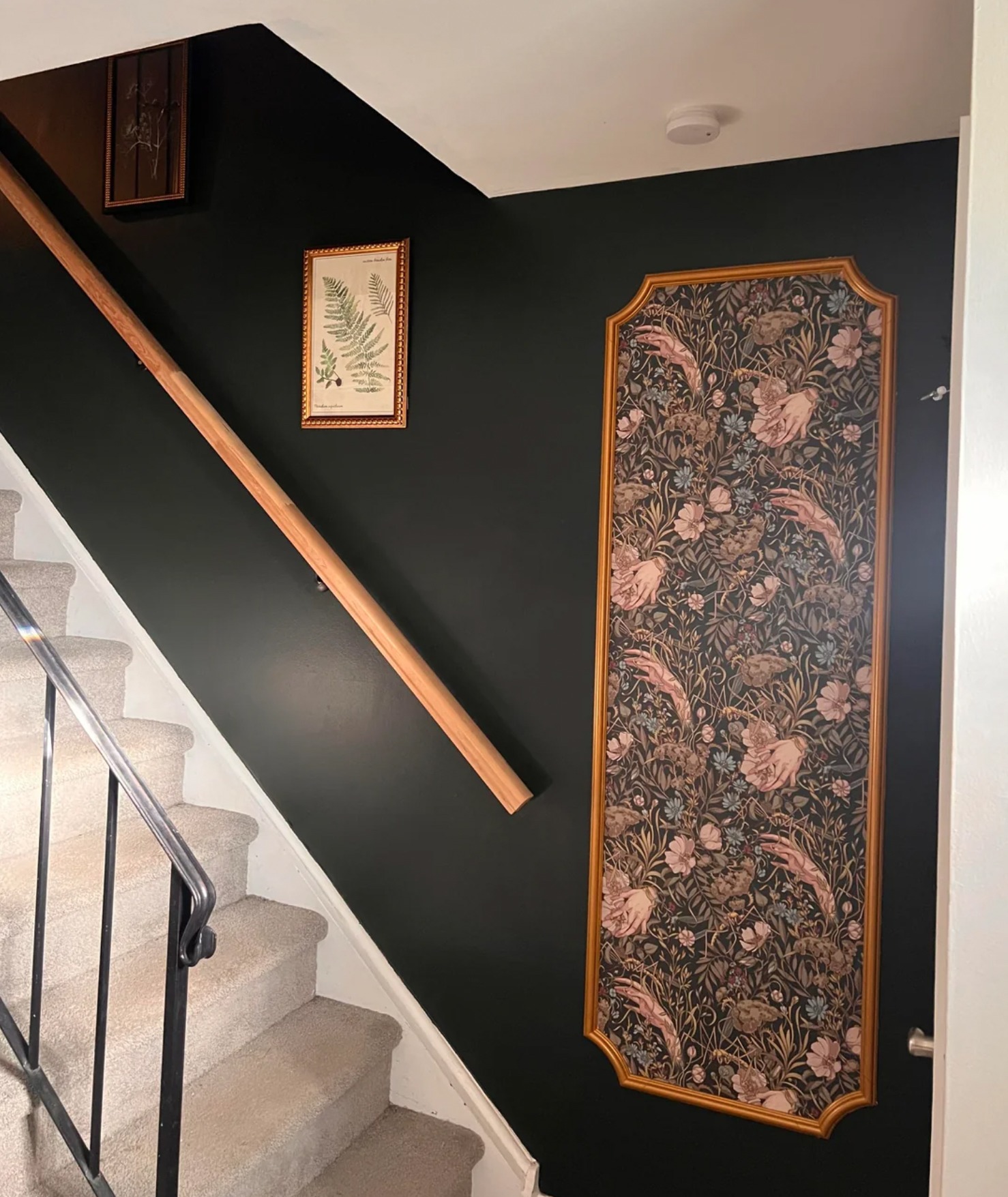 Reddit user jfcletmein transformed their stairway with DIY framed murals