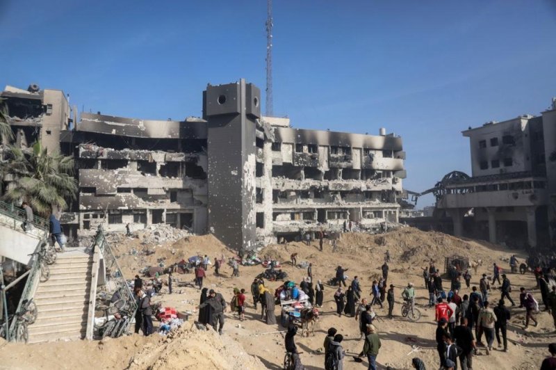 Palestinians inspect the damage outside al-Shifa Hospital in Gaza City after Israeli troops withdrew from it Monday following a two-week operation. Photo by Mohamed Hajjar/EPA-EFE