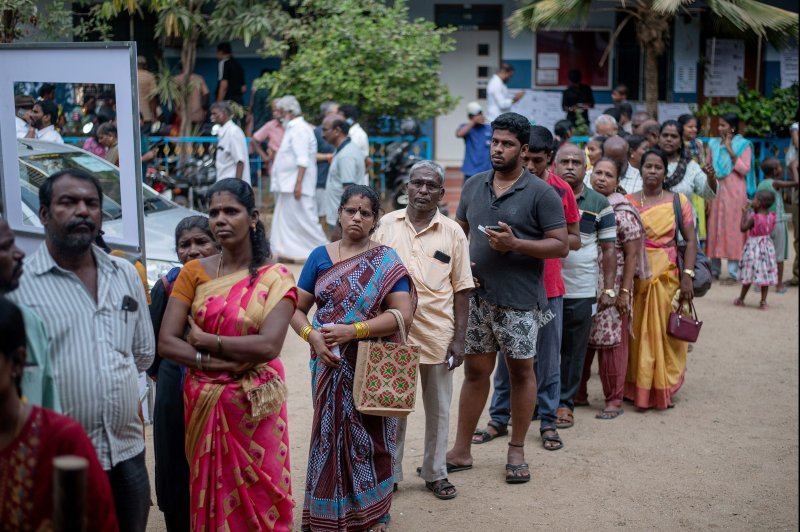 Voters in line to cast their ballots Friday outside a polling station in Chennai, southern India, in a election for the 18th Lok Sabha since independence from Britain in 1947, a two-way contest widely expected to be won by the Bharatiya Janata Party, sweeping the country's populist prime minister Minister Narendra Modi to a third term in office. Photo by Ragul Krishnan/EPA-EFE